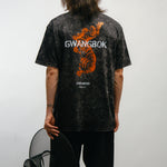 Person wearing a black t-shirt with 'GWANGBOK' design and an orange Korean tiger on the back, standing against a white background.