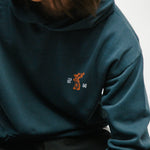 Person wearing a navy hoodie with a small tiger graphic and 광복 text on the chest.
