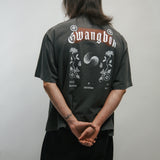 Person wearing a dark grey t-shirt with 'Gwangbok' branding on the back against a plain background