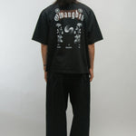 Person wearing a black t-shirt with 'Gwangbok' design on the back against a plain background