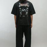 Person wearing a black t-shirt with 'Gwangbok' design on the back against a plain background