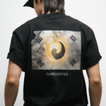 Person wearing a black t-shirt with a design of a vintage Korean Flag on the back, standing against a plain background.