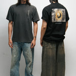 Two male models wearing black and dark grey t-shirts with Korean Flag graphic designs, one facing forward and one facing backward.